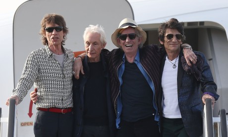 Mick Jagger, Charlie Watts, Keith Richards and Ronnie Wood of the Rolling Stones exit their plane after landing at José Martí airport in Havana on Thursday. FOTO JOE RAEDLE